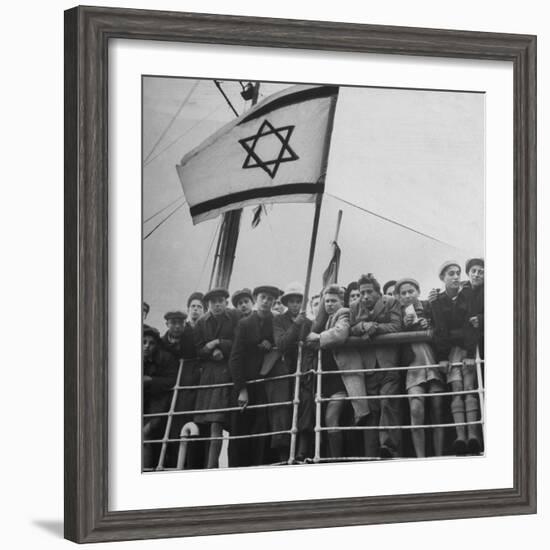 Jewish Immigrants, Arriving in Haifa Aboard Refugee Ship, Waving Future Flag of the State of Israel-Dmitri Kessel-Framed Photographic Print