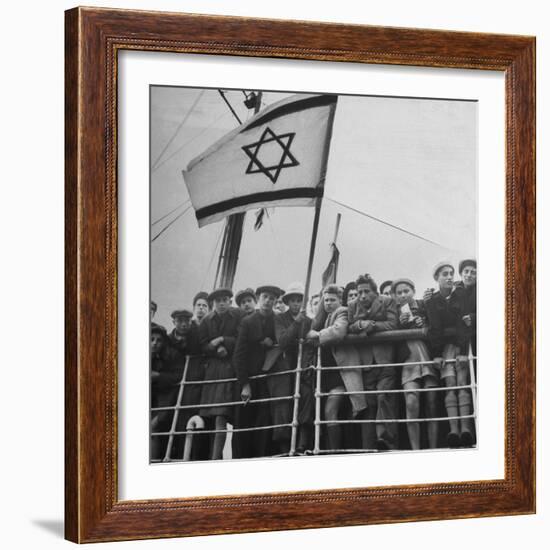 Jewish Immigrants, Arriving in Haifa Aboard Refugee Ship, Waving Future Flag of the State of Israel-Dmitri Kessel-Framed Photographic Print