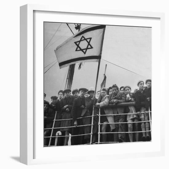 Jewish Immigrants, Arriving in Haifa Aboard Refugee Ship, Waving Future Flag of the State of Israel-Dmitri Kessel-Framed Photographic Print