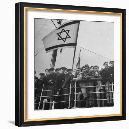 Jewish Immigrants, Arriving in Haifa Aboard Refugee Ship, Waving Future Flag of the State of Israel-Dmitri Kessel-Framed Photographic Print