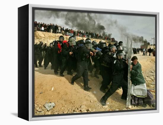 Jewish Settler Struggles with an Israeli Security Officer as Authorities Evacuated the Settlement-null-Framed Premier Image Canvas