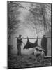 Jim Atchley and Dr. Ray Atchley Carrying Boar That They Killed-Ralph Crane-Mounted Photographic Print