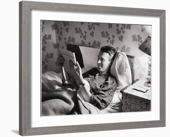 Jimmy Stewart, Dressed in Silk Pajamas Reading Magazine in Bed in Family Home-Peter Stackpole-Framed Premium Photographic Print