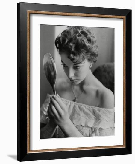 Joan Collins Studies Her Reflection-Associated Newspapers-Framed Photo