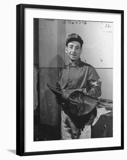 Jockey Johnny Longden Smiling and Holding Saddle-Martha Holmes-Framed Premium Photographic Print