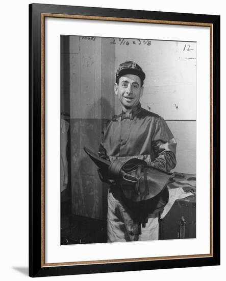 Jockey Johnny Longden Smiling and Holding Saddle-Martha Holmes-Framed Premium Photographic Print