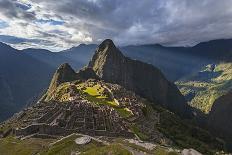 Light Streams Through The Clouds And Lights Parts Of The Ancient City Of Machu Picchu-Joe Azure-Photographic Print