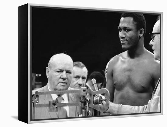 Joe Frazier at the Weigh in for His Fight Against Muhammad Ali-John Shearer-Framed Premier Image Canvas