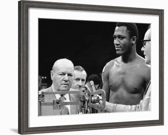 Joe Frazier at the Weigh in for His Fight Against Muhammad Ali-John Shearer-Framed Premium Photographic Print