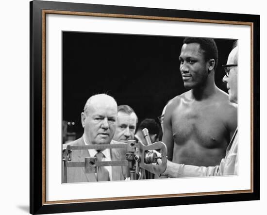 Joe Frazier at the Weigh in for His Fight Against Muhammad Ali-John Shearer-Framed Premium Photographic Print