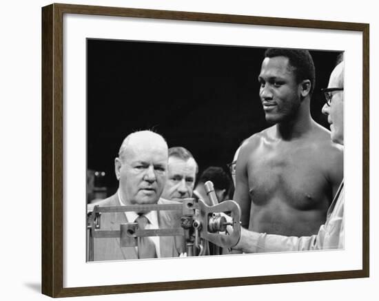 Joe Frazier at the Weigh in for His Fight Against Muhammad Ali-John Shearer-Framed Premium Photographic Print