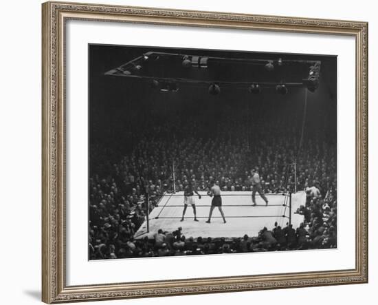 Joe Louis and Joe Walcott Boxing in Front of a Wide Eyed Crowd-Andreas Feininger-Framed Premium Photographic Print