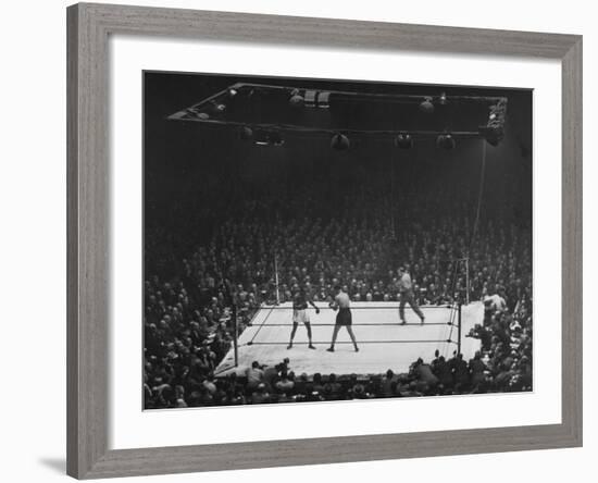 Joe Louis and Joe Walcott Boxing in Front of a Wide Eyed Crowd-Andreas Feininger-Framed Premium Photographic Print