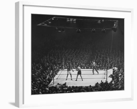 Joe Louis and Joe Walcott Boxing in Front of a Wide Eyed Crowd-Andreas Feininger-Framed Premium Photographic Print