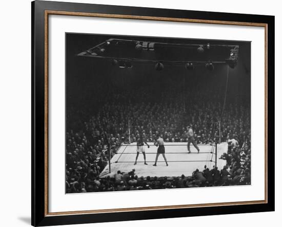 Joe Louis and Joe Walcott Boxing in Front of a Wide Eyed Crowd-Andreas Feininger-Framed Premium Photographic Print