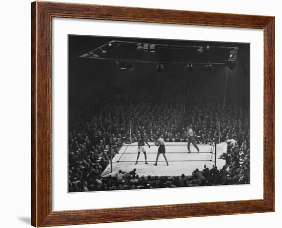 Joe Louis and Joe Walcott Boxing in Front of a Wide Eyed Crowd-Andreas Feininger-Framed Premium Photographic Print