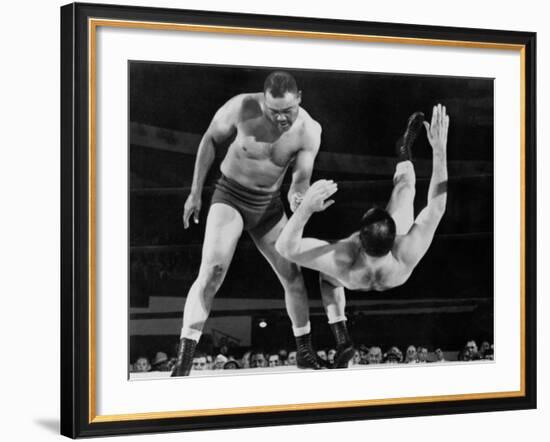 Joe Louis Throws Jim Bernard to the Mat During a 1956 Wrestling Match in Detroit-null-Framed Photo