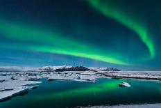 The Northern Lights Dance over the Glacier Lagoon in Iceland.-John A Davis-Photographic Print
