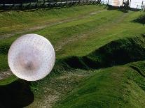 Zorbs People Moving Inside Balls on Lawn, Rotorua, New Zealand-John Banagan-Premier Image Canvas