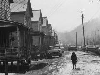 Small Girl Walking Down the Poverty Stricken Town of Hemphill in Appalachia-John Dominis-Photographic Print