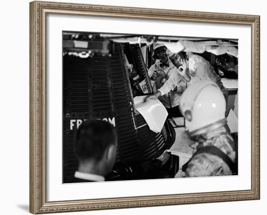 John Glenn Checking Out Mercury Capsule That Will Launch Alan Shepard into Space-Ralph Morse-Framed Premium Photographic Print