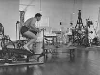 Men Exercising in Gymnasium at Homestead Hotel-John Phillips-Premium Photographic Print