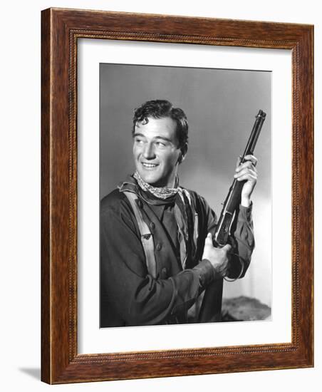 John Wayne in Costume for Stagecoach, 1939-null-Framed Photo