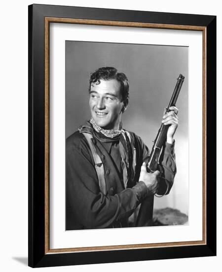 John Wayne in Costume for Stagecoach, 1939-null-Framed Photo