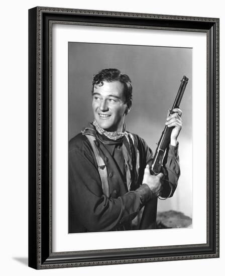 John Wayne in Costume for Stagecoach, 1939-null-Framed Photo