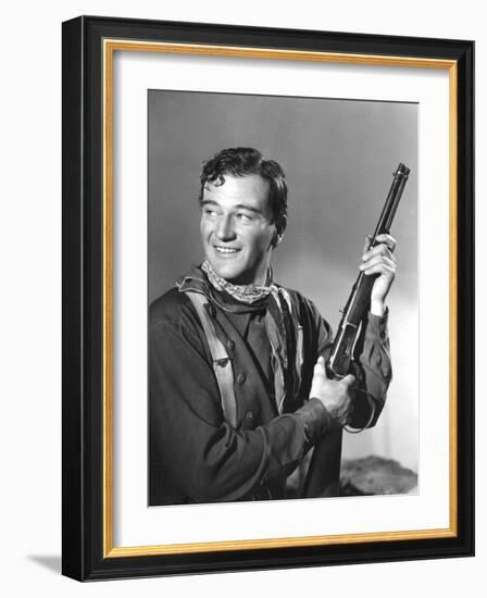 John Wayne in Costume for Stagecoach, 1939-null-Framed Photo