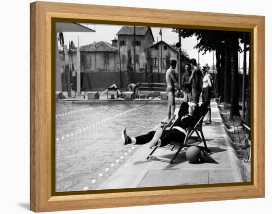 Johnny Dorelli at the Edge of a Swimming Pool-Angelo Cozzi-Framed Premier Image Canvas