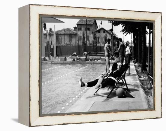 Johnny Dorelli at the Edge of a Swimming Pool-Angelo Cozzi-Framed Premier Image Canvas