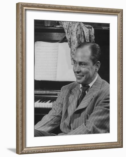 Johnny Mercer Smiling at the Piano During the Lil Abner Rehearsal-Gjon Mili-Framed Premium Photographic Print