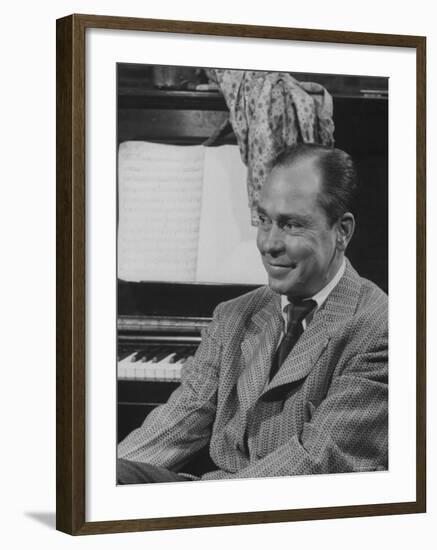 Johnny Mercer Smiling at the Piano During the Lil Abner Rehearsal-Gjon Mili-Framed Premium Photographic Print