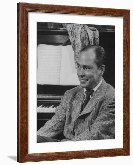 Johnny Mercer Smiling at the Piano During the Lil Abner Rehearsal-Gjon Mili-Framed Premium Photographic Print