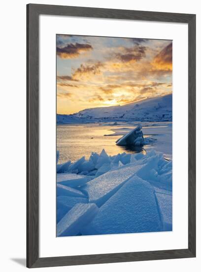 Jokulsarlon glacier lagoon, Iceland, Europe. Blocks of ice in the frozen lagoon on a winter sunset.-Marco Bottigelli-Framed Photographic Print