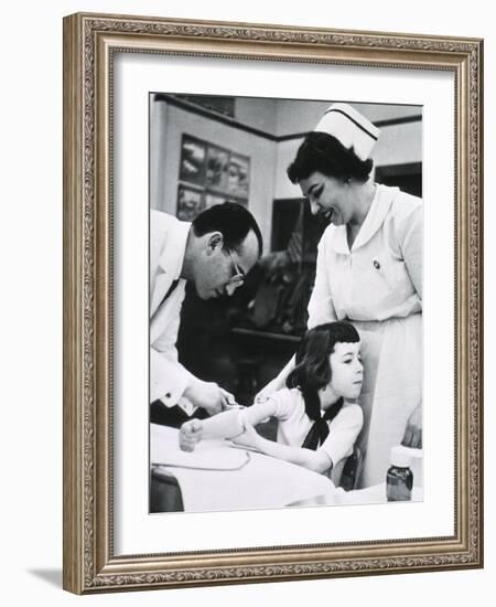 Jonas E. Salk Inoculating Child with Polio Vaccine He Developed, Ca. 1955-null-Framed Photo