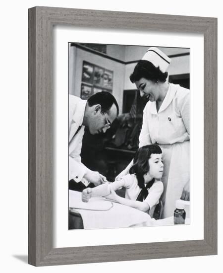 Jonas E. Salk Inoculating Child with Polio Vaccine He Developed, Ca. 1955-null-Framed Photo