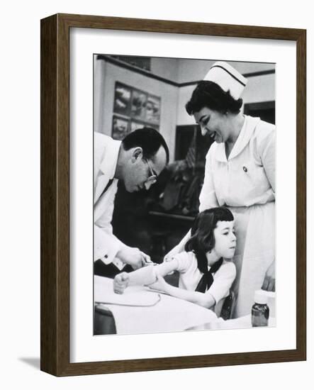 Jonas E. Salk Inoculating Child with Polio Vaccine He Developed, Ca. 1955-null-Framed Photo