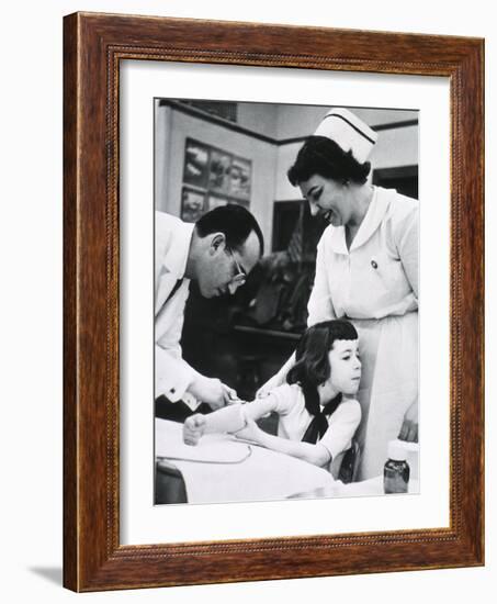 Jonas E. Salk Inoculating Child with Polio Vaccine He Developed, Ca. 1955-null-Framed Photo