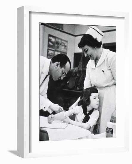 Jonas E. Salk Inoculating Child with Polio Vaccine He Developed, Ca. 1955-null-Framed Photo