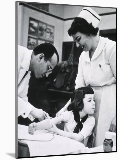 Jonas E. Salk Inoculating Child with Polio Vaccine He Developed, Ca. 1955-null-Mounted Photo