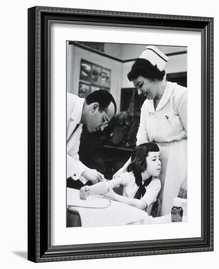 Jonas E. Salk Inoculating Child with Polio Vaccine He Developed, Ca. 1955-null-Framed Photo