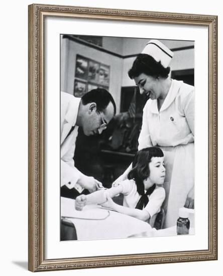 Jonas E. Salk Inoculating Child with Polio Vaccine He Developed, Ca. 1955-null-Framed Photo