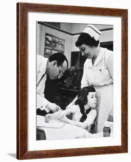 Jonas E. Salk Inoculating Child with Polio Vaccine He Developed, Ca. 1955-null-Framed Photo