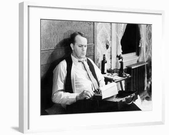 Journalist Sitting on His Bed with a Typewriter, Typing-null-Framed Photo