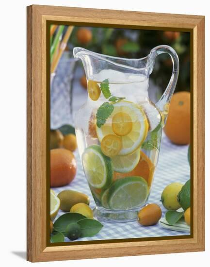 Jug of Water with Citrus Fruit, Lemon Balm and Ice Cubes-F. Strauss-Framed Premier Image Canvas