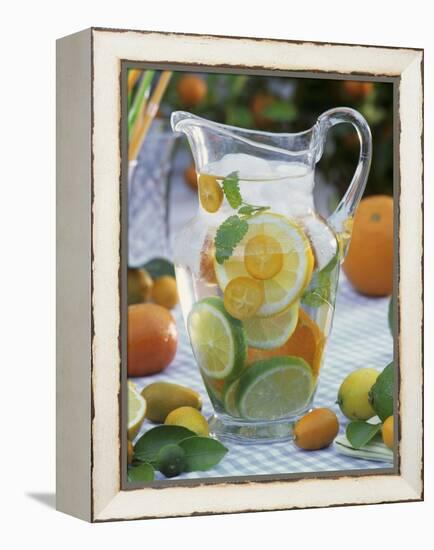 Jug of Water with Citrus Fruit, Lemon Balm and Ice Cubes-F. Strauss-Framed Premier Image Canvas