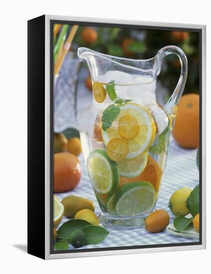 Jug of Water with Citrus Fruit, Lemon Balm and Ice Cubes-F. Strauss-Framed Premier Image Canvas