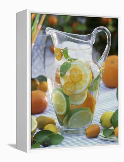 Jug of Water with Citrus Fruit, Lemon Balm and Ice Cubes-F. Strauss-Framed Premier Image Canvas